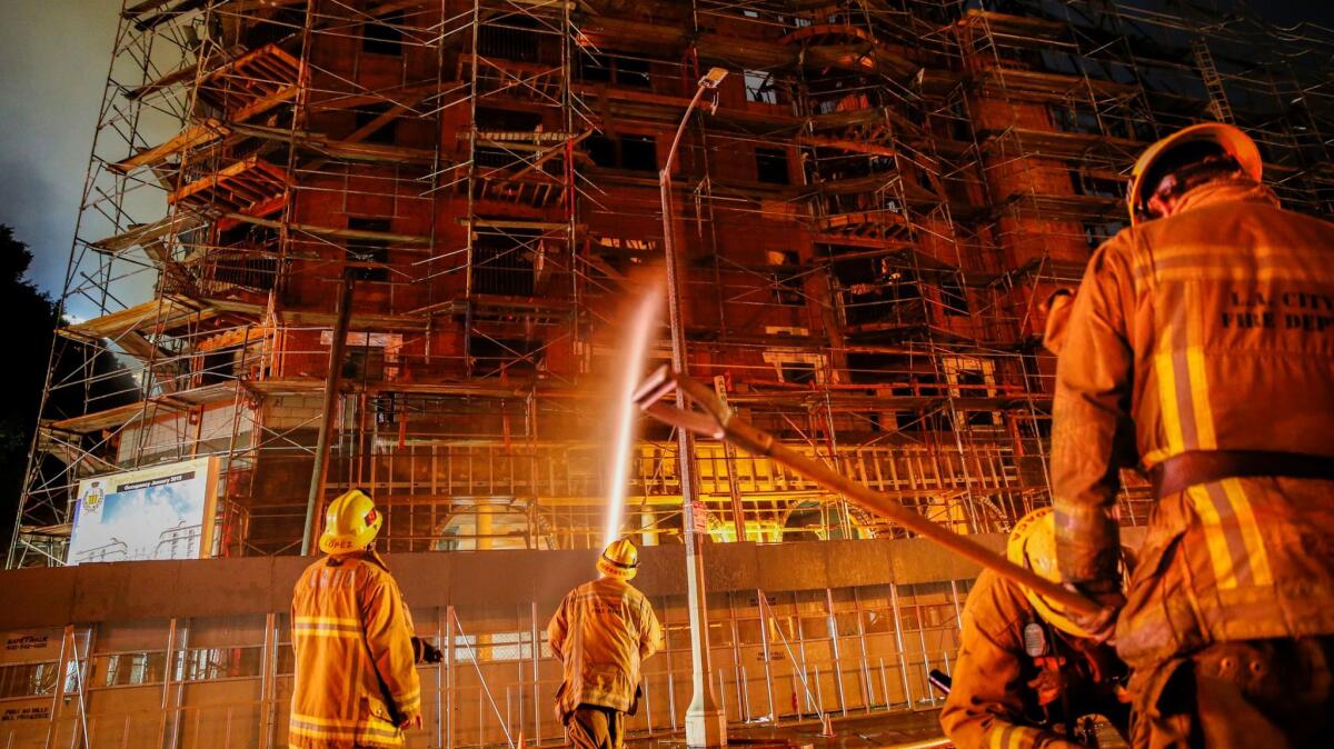Firefighters battle a massive fire at the Da Vinci apartment complex under construction in downtown Los Angeles on Dec. 8, 2014.