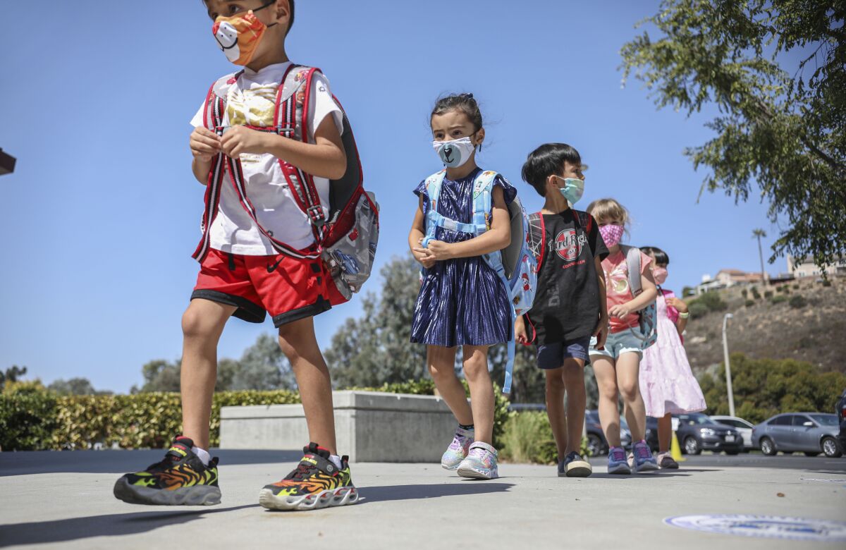 Kindergarten students walk to class at Sunset Hills Elementary School in Poway Unified School District on October 1, 2020.