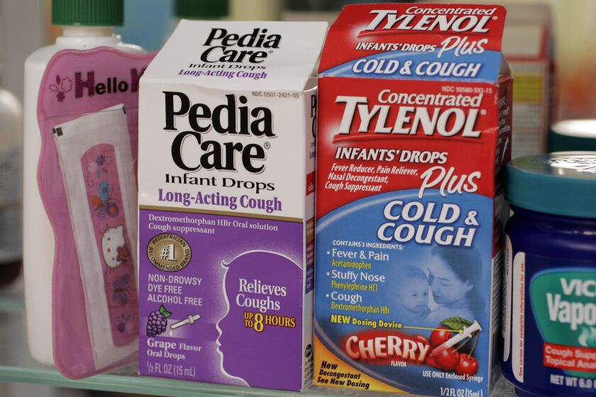 ** FILE ** Concentrated Tylenol Infants' Drops Plus Cold & Cough, right, and Pedia Care Infant Drops Long-Acting Cough, left, is shown in a medicine cabinet of the home of Carol Uyeno in Palo Alto, Calif., Thursday, Oct. 11, 2007. Cold Drug makers voluntarily pulled cold medicines targeted for babies and toddlers off the market Thursday, leaving parents to find alternatives for hacking coughs and runny little noses just as fall sniffles get in full swing. The move represented a pre-emptive strike by over-the-counter drug manufacturers - a week before government advisers were to debate the medicines' fate. But it doesn't end concern about the safety of these remedies for youngsters. (AP Photo/Paul Sakuma)