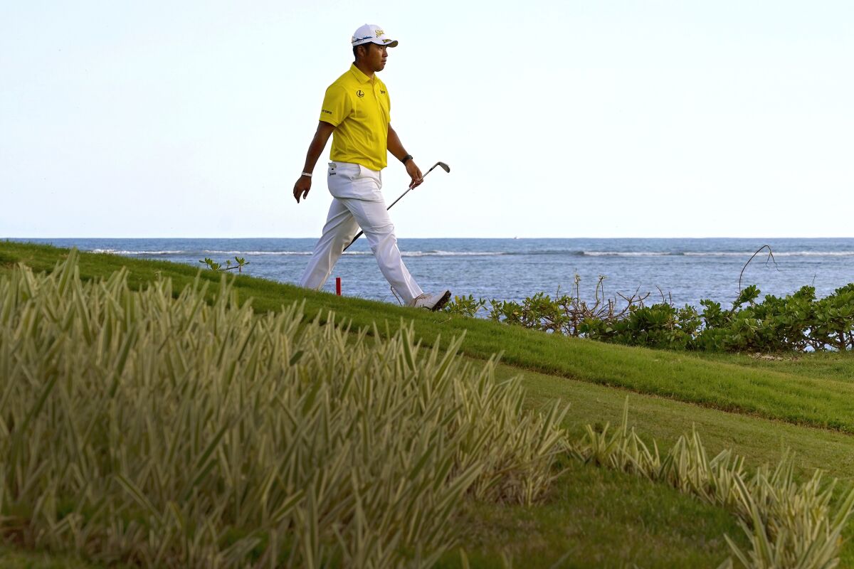 Hideki Matsuyama, of Japan, walks up the 17th fairway during the final round of the Sony Open golf tournament, Sunday, Jan. 16, 2022, at Waialae Country Club in Honolulu. (AP Photo/Matt York)