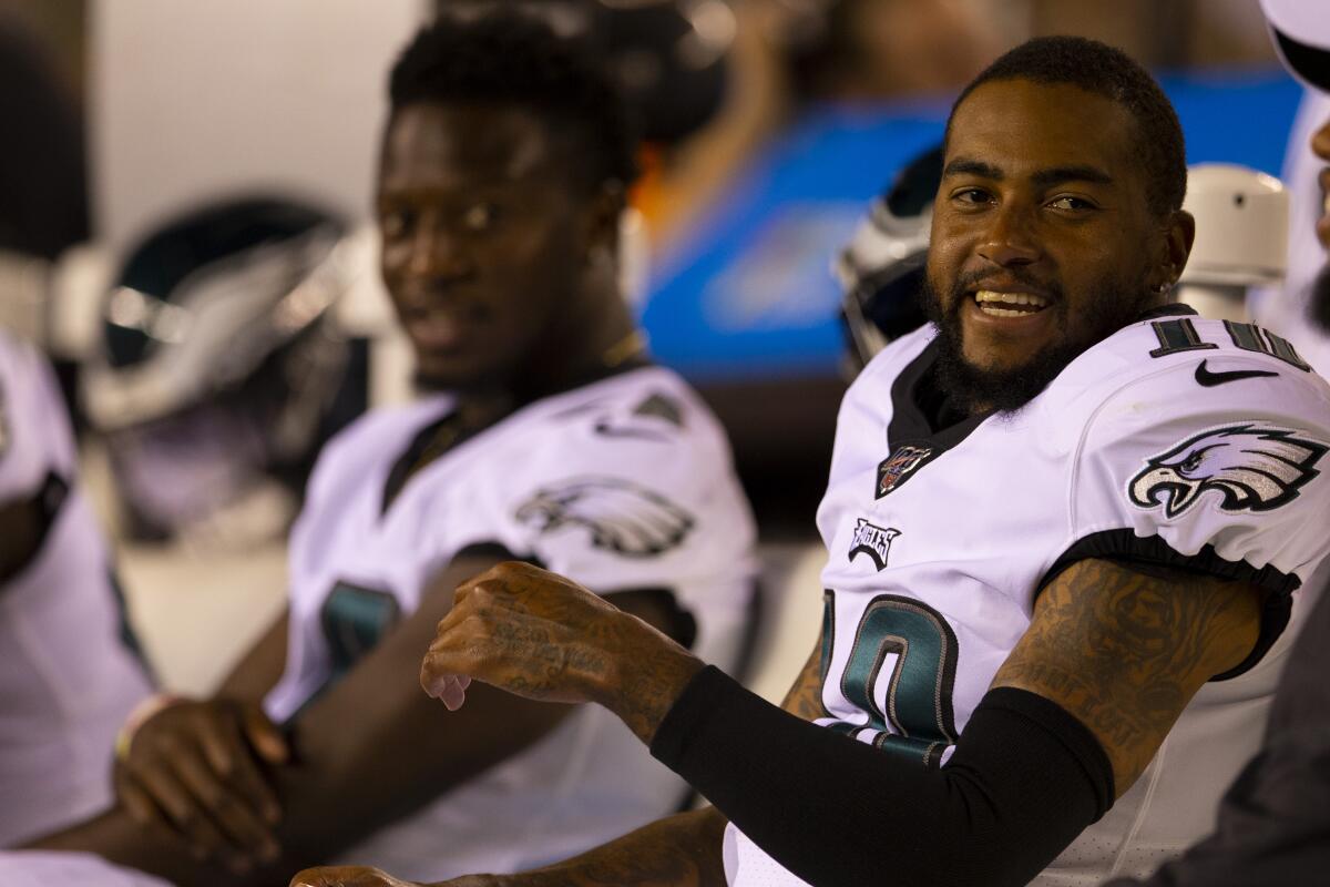 Philadelphia Eagles wide receiver DeSean Jackson laughs while sitting on the bench.