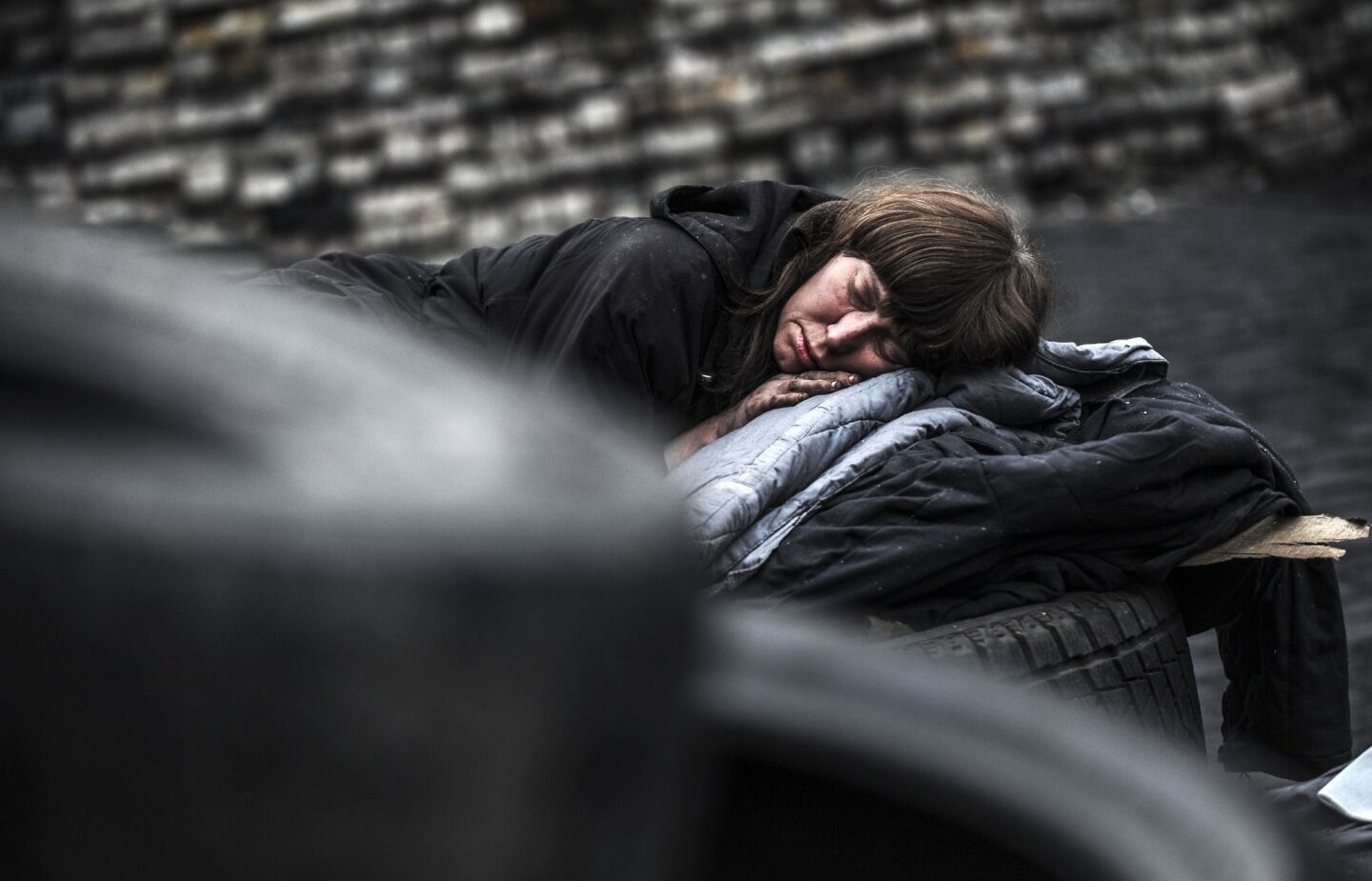 A woman sleeps behind a barricade on Kiev's Independence square.