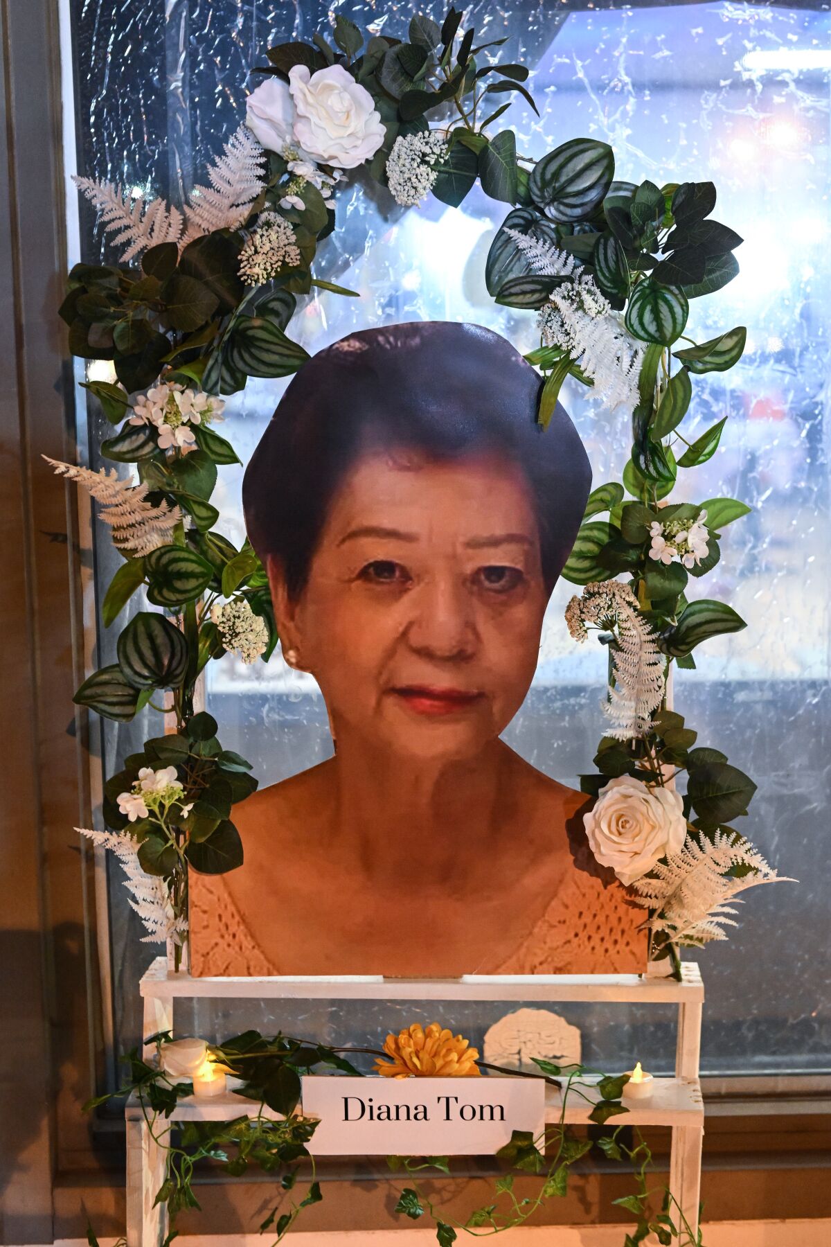 A portrait of Diana Man Ling Tom sits on display in front of the dance studio.
