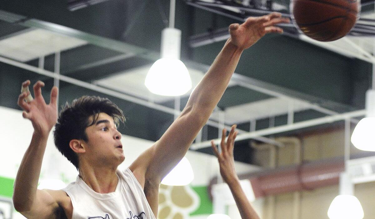 Cathedral's Kobe Paras blocks a shot in February 2015.