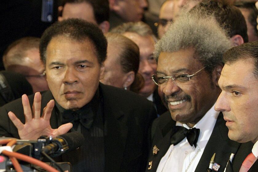 ''Without question his legacy is one that he defied the odds because he stood up for what he believed in and when he was put to the test he took personal harm rather than go against his beliefs and what he stood for." — Don King, shown second from right, promoter of the famous boxing matches "Rumble in the Jungle" and "Thrilla in Manilla"