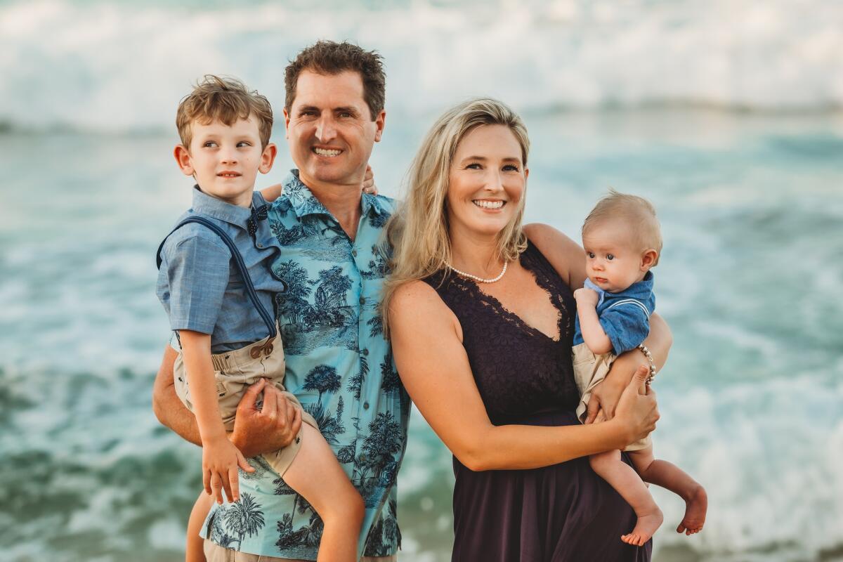 Portrait of UCLA alumnus Matt Kovach with his wife, Nicole, and sons Alex and Carter.