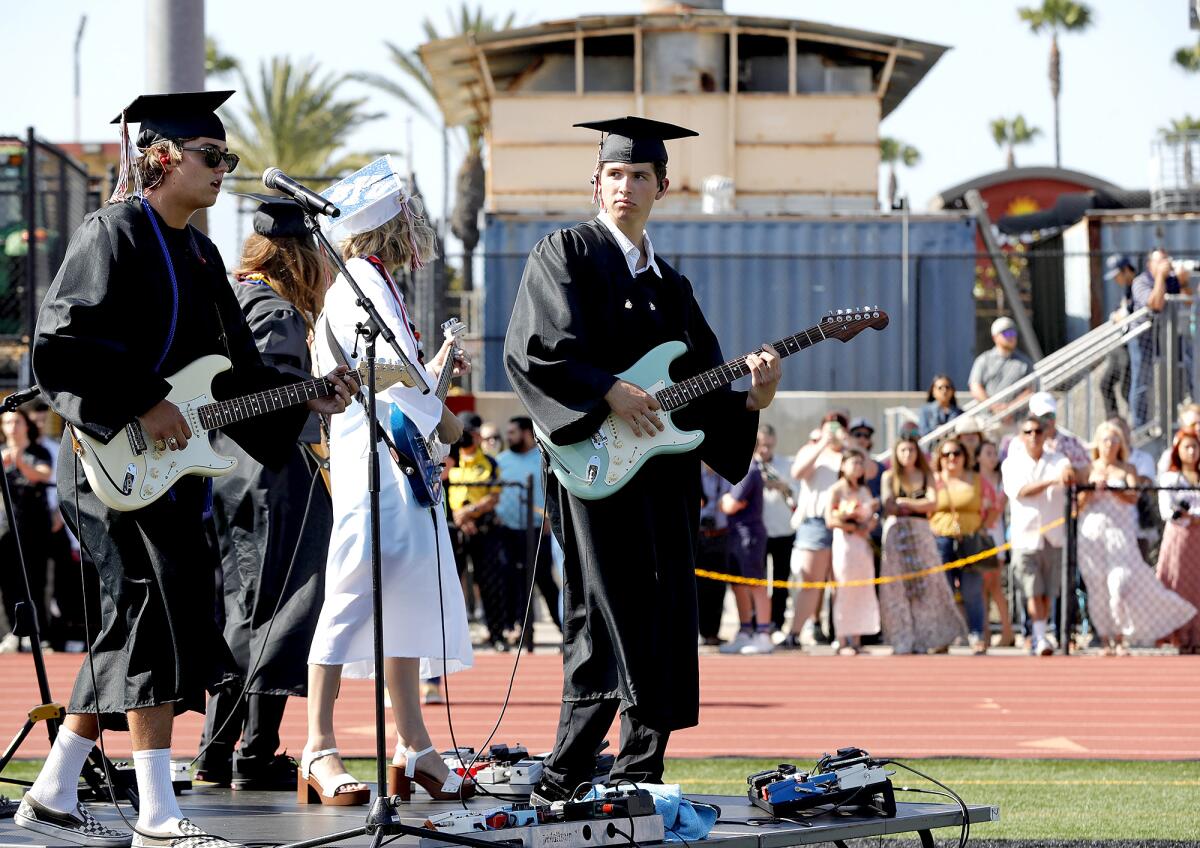 Commencement performers of the MMET band including guitarist Blake Bennett, far right, play at Tuesday's ceremony.