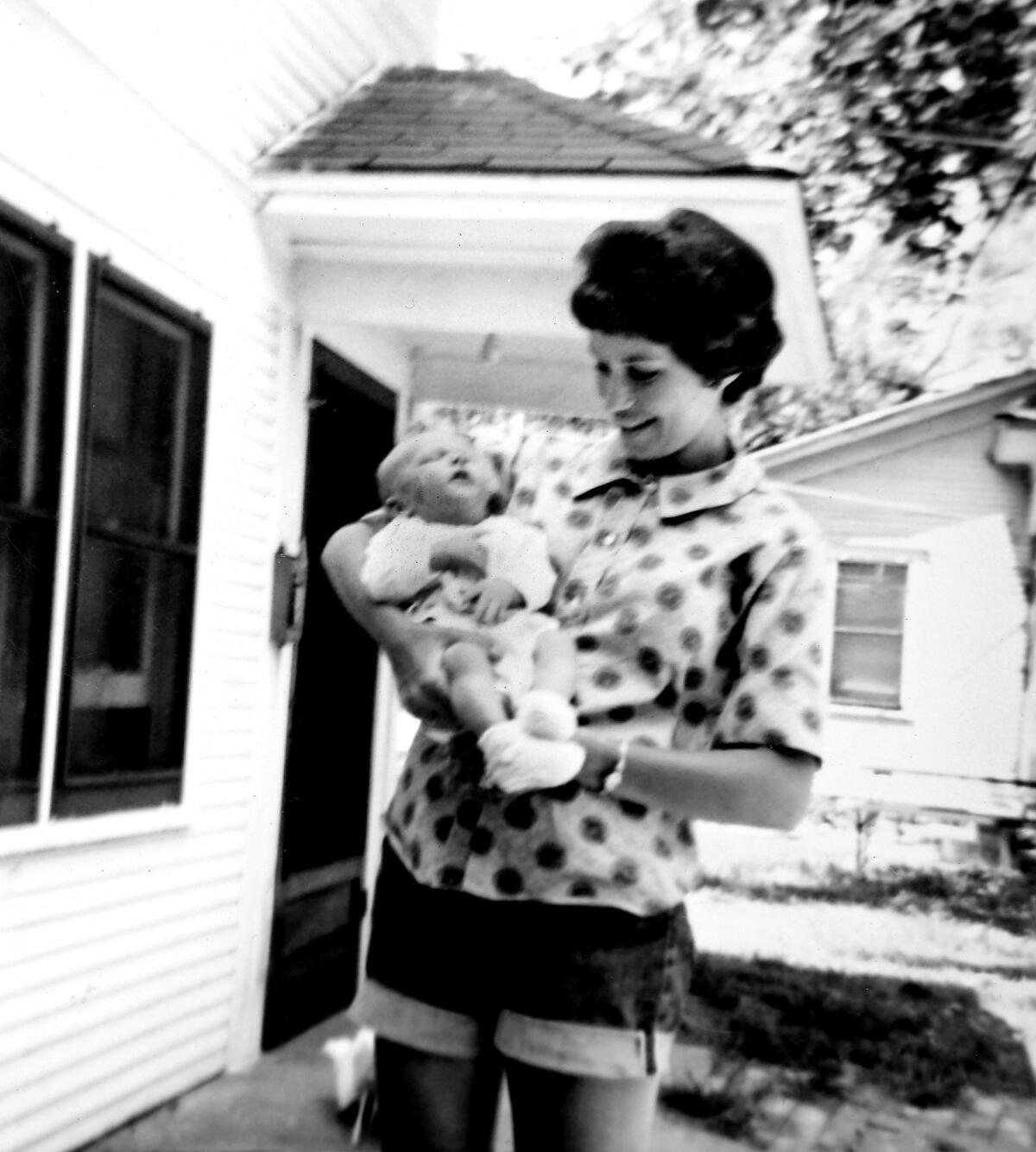 Patricia Hamlin holds her 5-month-old son, Kevin, at their home in Wichita, Kan., in 1962.