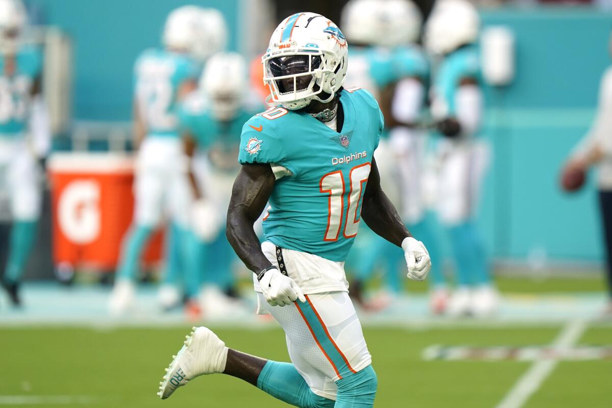 Dolphins wide receiver Tyreek Hill (10) runs before a game in Miami.