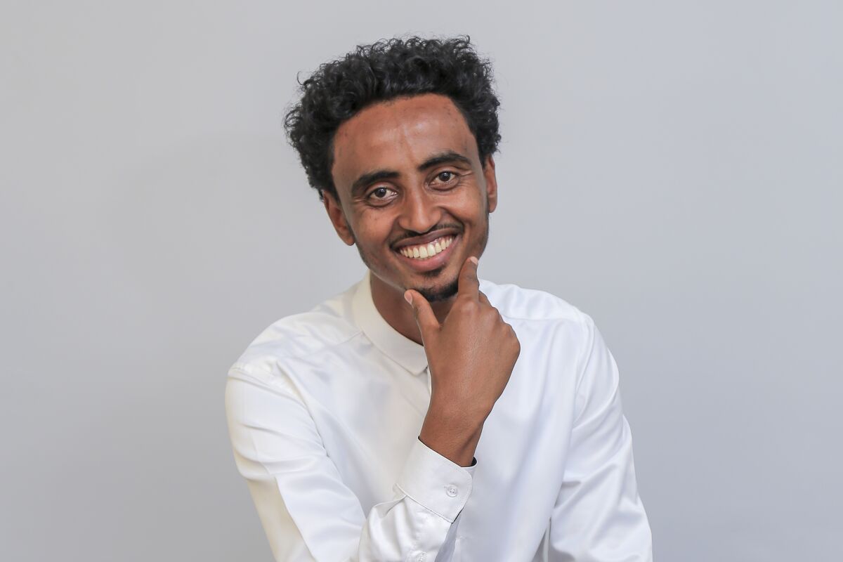 Freelance video journalist Amir Aman Kiyaro, who is accredited to The Associated Press, poses for a photograph in Ethiopia on Sunday, Oct. 17, 2021. The Associated Press and press freedom advocates are calling for the immediate release of Kiyaro, who marked 100 days in detention without charge in March 2022. (AP Photo)