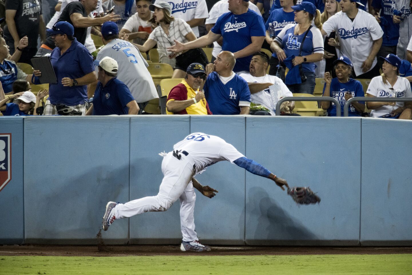 Dodgers right fielder Yasiel Puig throws his glove in anger after not being able to catch a ground-rule double by Astros third baseman Alex Bregman.