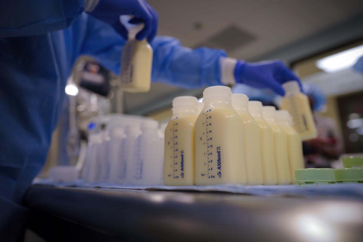At the UC Health Milk Bank, bottles are filled with breast milk to be pasteurized. 