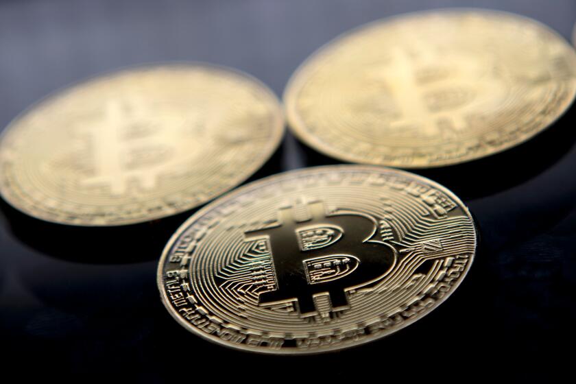 (FILES) This file photo taken on November 20, 2017 shows gold plated souvenir Bitcoin coins arranged for a photograph in London. Bitcoin, which this week soared to a new record high of more than $8,000, is the monetary equivalent of Uber, since it bypasses central bank regulation and could be attractive for financially fragile countries, economists say. Nevertheless, it is precisely the lack of oversight that opens up the users of cryptocurrencies such as bitcoin to risks and dangers, analysts warn. / AFP PHOTO / Justin TALLISJUSTIN TALLIS/AFP/Getty Images ** OUTS - ELSENT, FPG, CM - OUTS * NM, PH, VA if sourced by CT, LA or MoD **