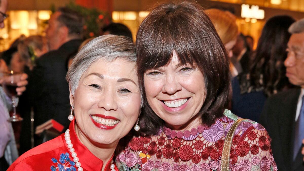 Anne Shih, Bowers Museum board chairwoman, and Debra Gunn Downing, executive director of marketing at South Coast Plaza, during the Year of the Dog Lunar New Year celebration at South Coast Plaza.