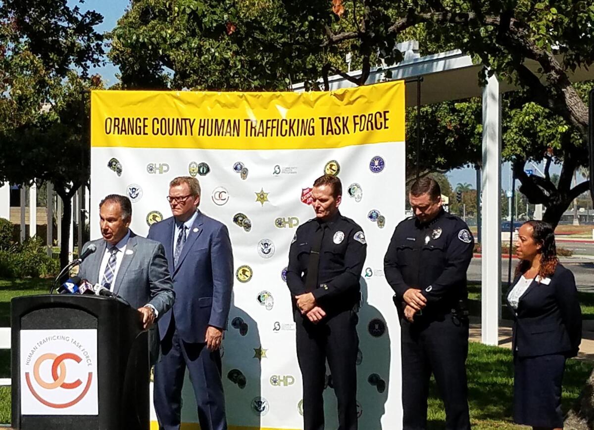 District Attorney Tony Rackauckas speaks during an Orange County Human Trafficking Task Force press conference Friday at Costa Mesa City Hall. Behind him from left are Costa Mesa Mayor Steve Mensinger, Anaheim Police Deputy Chief Julian Harvey, Costa Mesa Police Chief Rob Sharpnack and Lita Mercado, director of victim assistance programs for Community Service Programs.