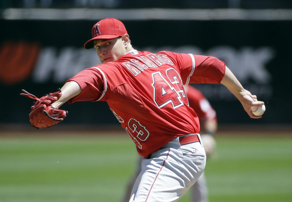 Angels starting pitcher Garrett Richards throws a pitch during the first inning of Thursday's game against the Athletics.
