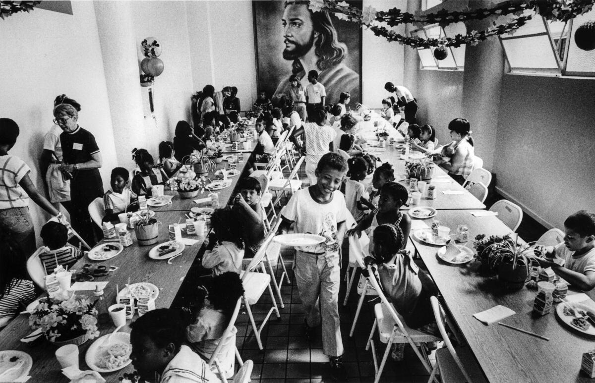 Aug. 11, 1987: Children from skid row hotels and the encampment have breakfast at the Fred Jordan Mission day care program.