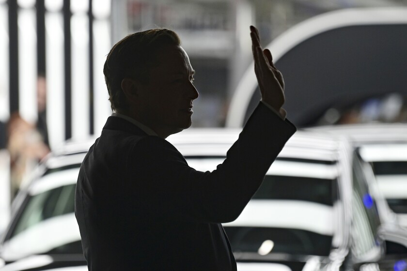 FILE - Elon Musk, Tesla CEO, attends the opening of the Tesla factory Berlin Brandenburg in Gruenheide, Germany, Tuesday, March 22, 2022. Many people are puzzled on what a Elon Musk takeover of Twitter would mean for the company and even whether he’ll go through with the deal. If the 50-year-old Musk’s gambit has made anything clear it’s that he thrives on contradiction. (Patrick Pleul/Pool via AP, File)