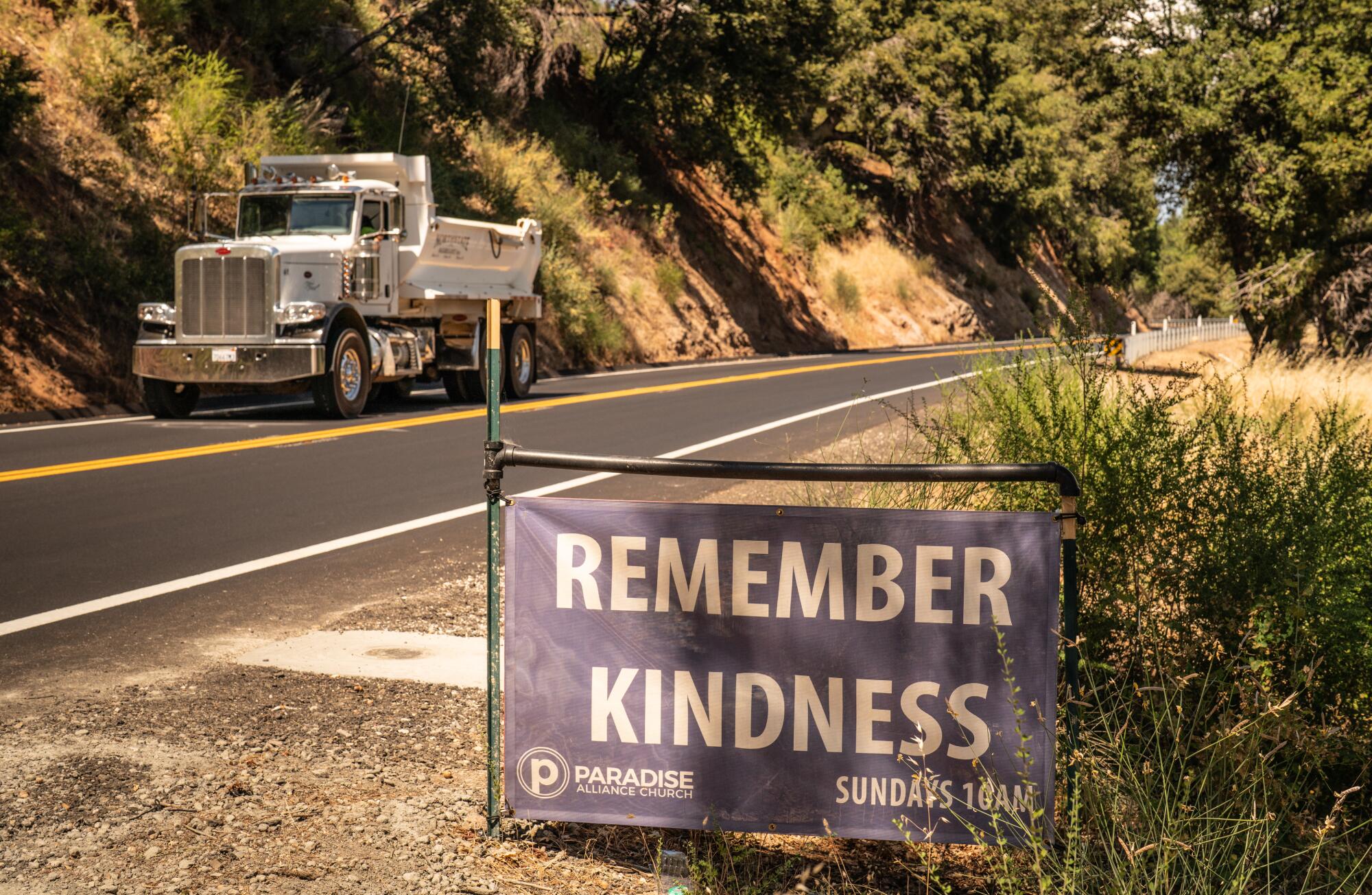 A sign in Paradise, Calif., says remember kindness.