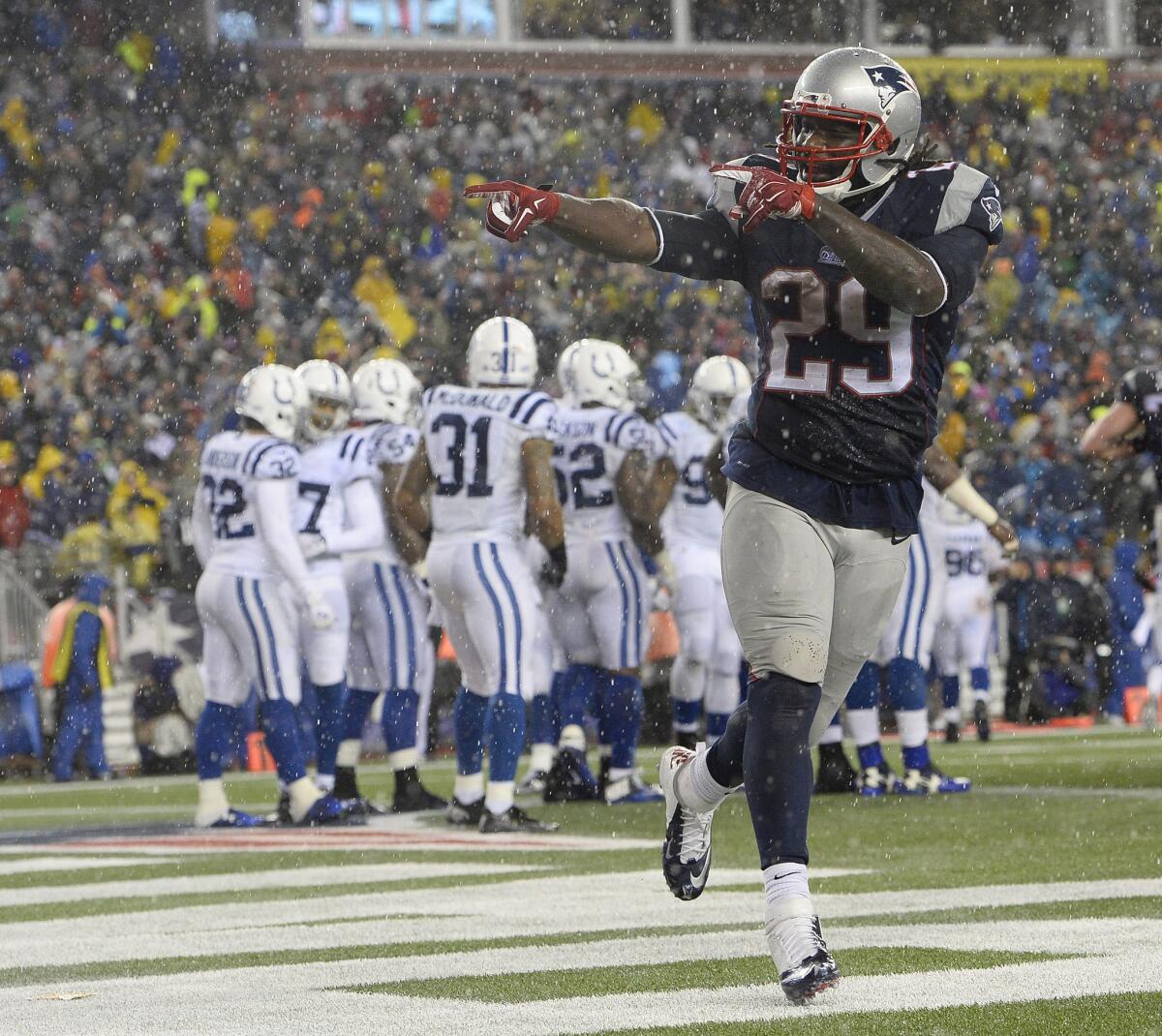 New England running back LeGarrette Blount celebrates one of his three touchdown carries against Indianapolis in the AFC Championship game Jan. 11 after being cut by Pittsburgh in November.