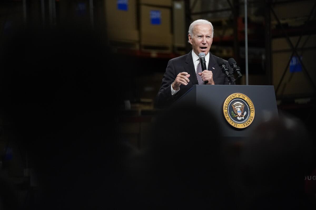 President Biden speaking at a lectern