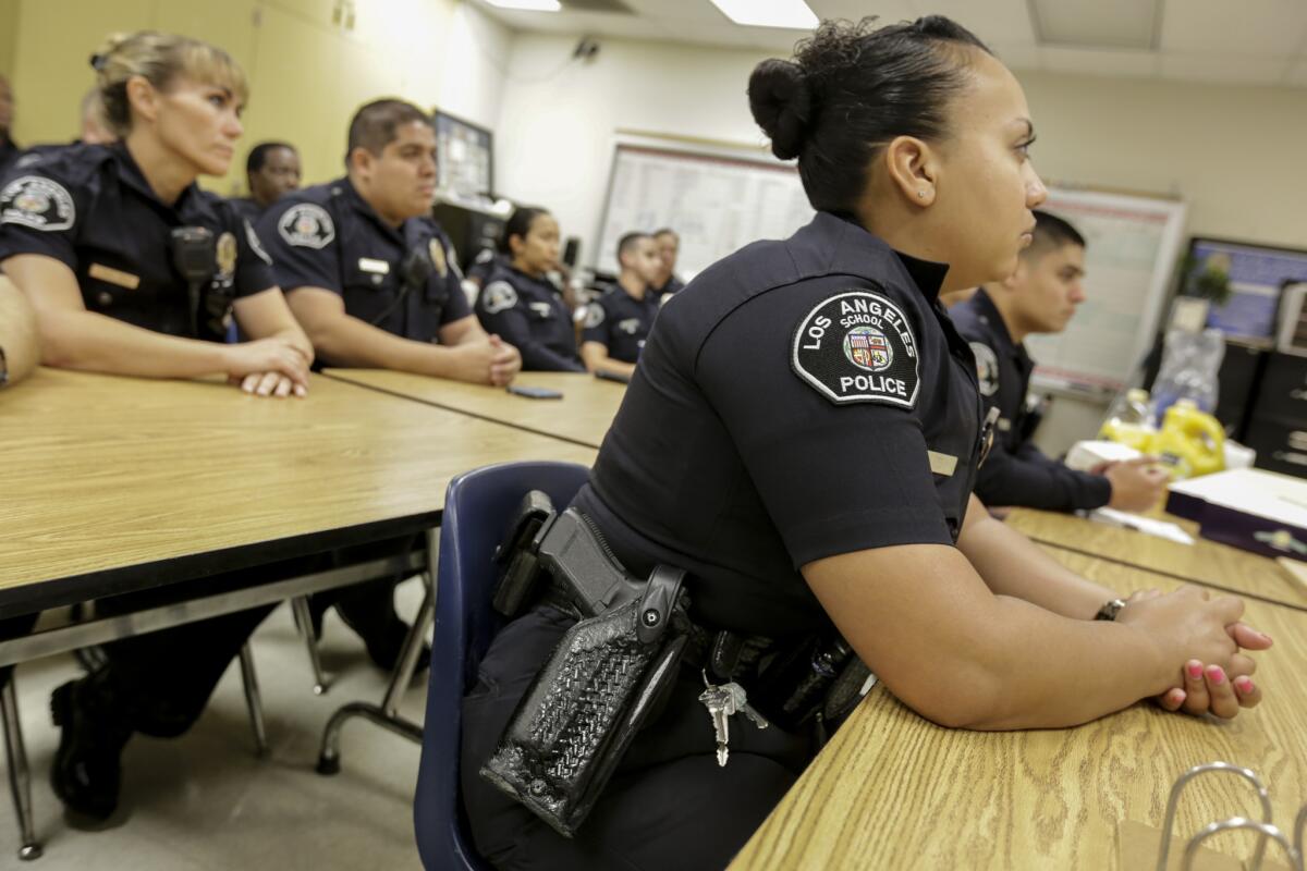 Los Angeles School police officers listen to a briefing at King Drew Magnet High School of Medicine and Science.