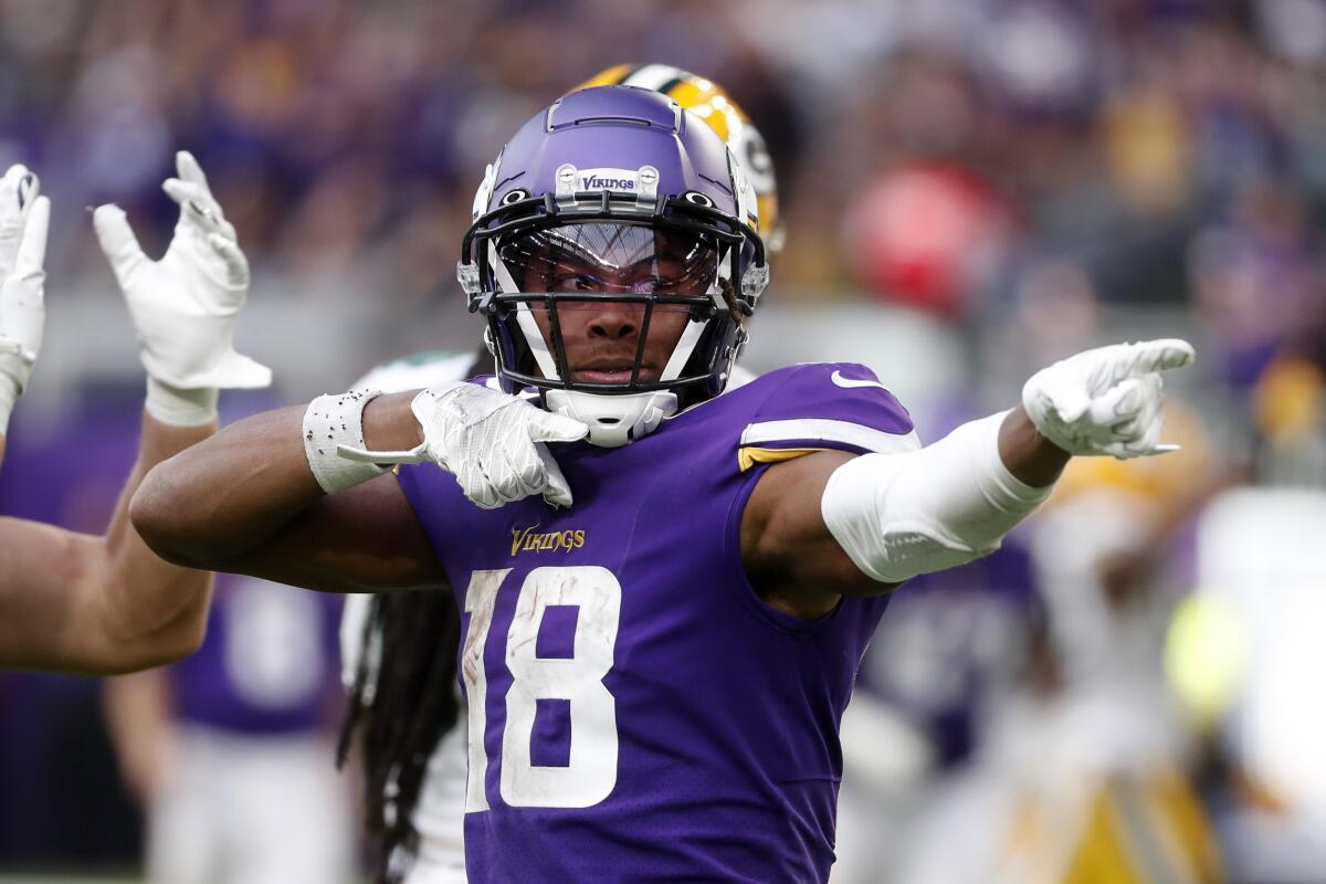 Minnesota Vikings wide receiver Justin Jefferson celebrates after catching a pass.