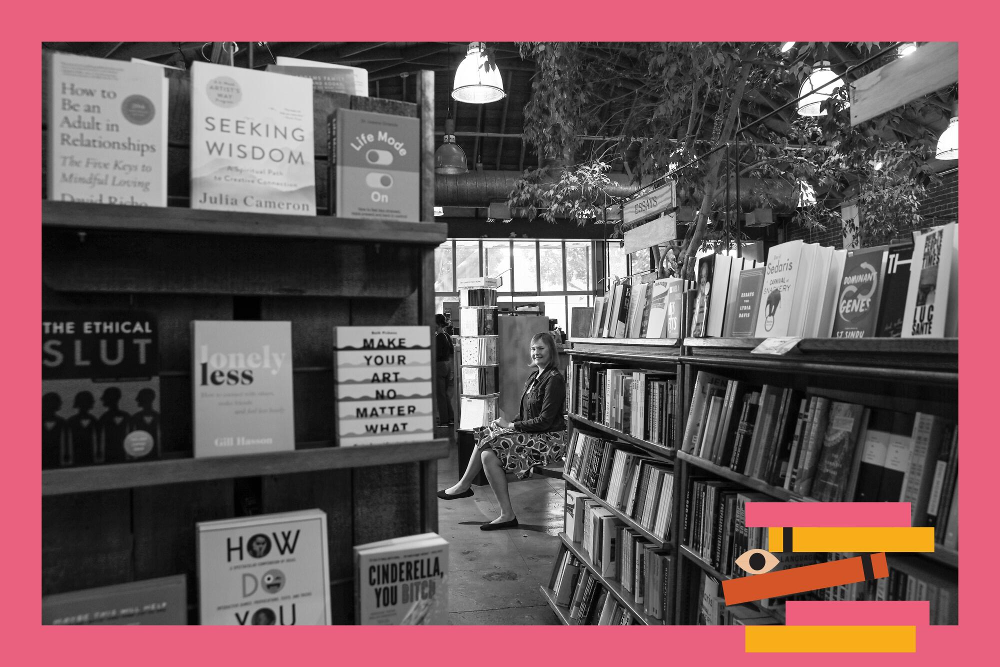 Skylights co-owner Mary Williams sits on a bench in the bookstore