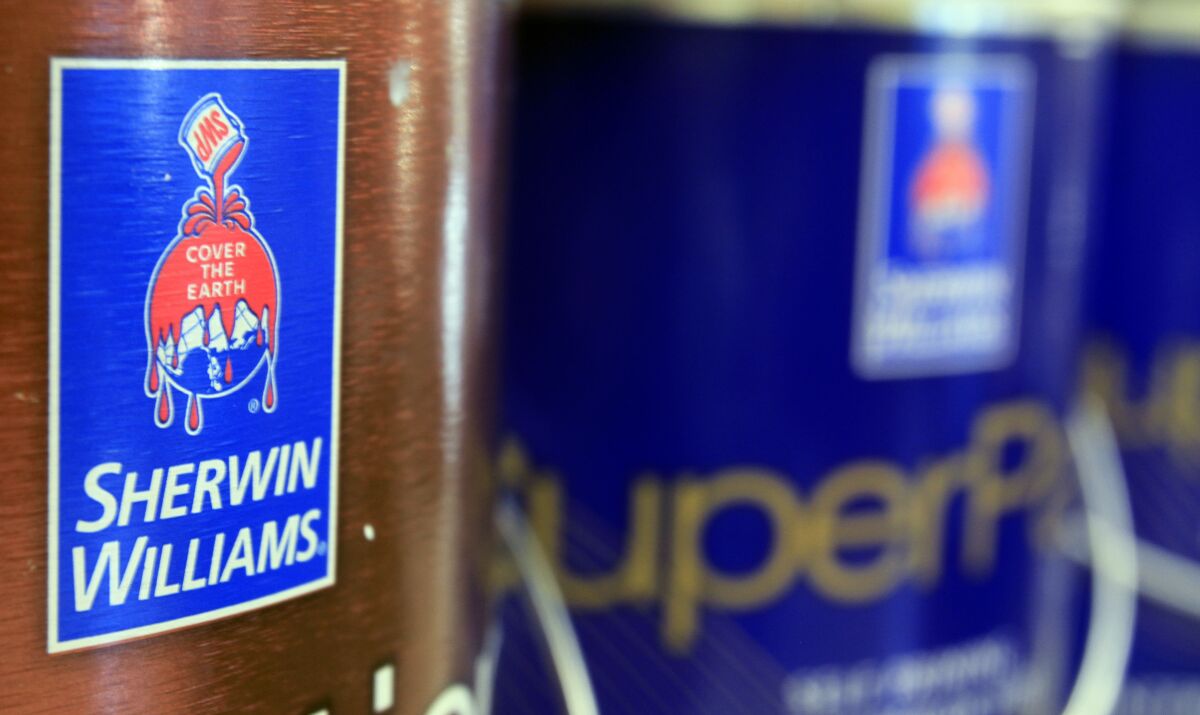 In this Oct. 20, 2010, file photo, cans of paint are seen at a Sherwin Williams store in Brunswick, Maine. Sherwin-Williams is one of a number of companies that have warned higher costs are hurting profits. (AP Photo/Pat Wellenbach, File)