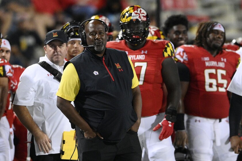 Maryland head coach Michael Locksley, foreground, watches from the sideline during the second half of an NCAA college football game against Howard, Saturday, Sept. 11, 2021, in College Park, Md. (AP Photo/Nick Wass)