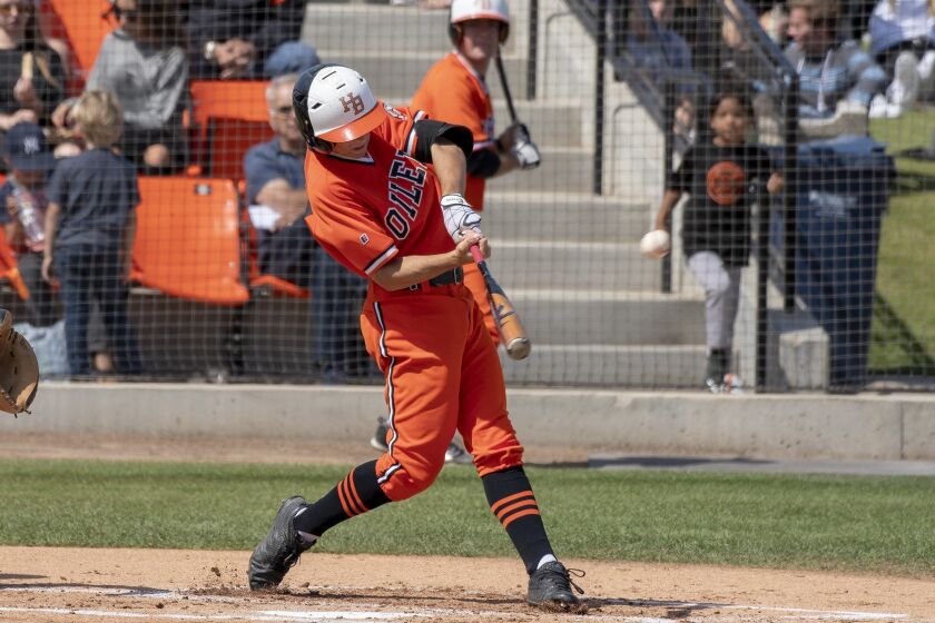 Huntington Beach's Jake Vogel hits a solo home run in the first inning againsgt Vista Murrieta during a first round CIF Southern Section Division 1 playoff game on Friday, May 18.