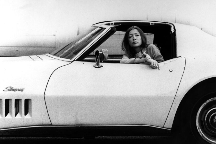 Joan Didion, seen here posing in a Corvette, is the subject of an anticipated documentary.