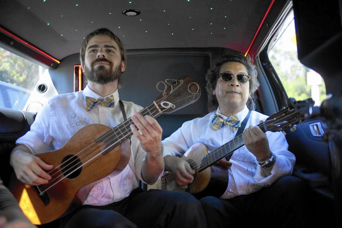 Rusty Kennedy, left and Alfredo Lopez perform in one of the scenes in a limo as part of "Hopscotch."