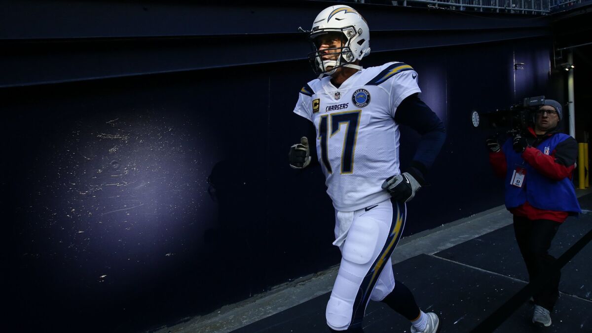 Chargers quarterback Philip Rivers takes the field against the New England Patriots last month.