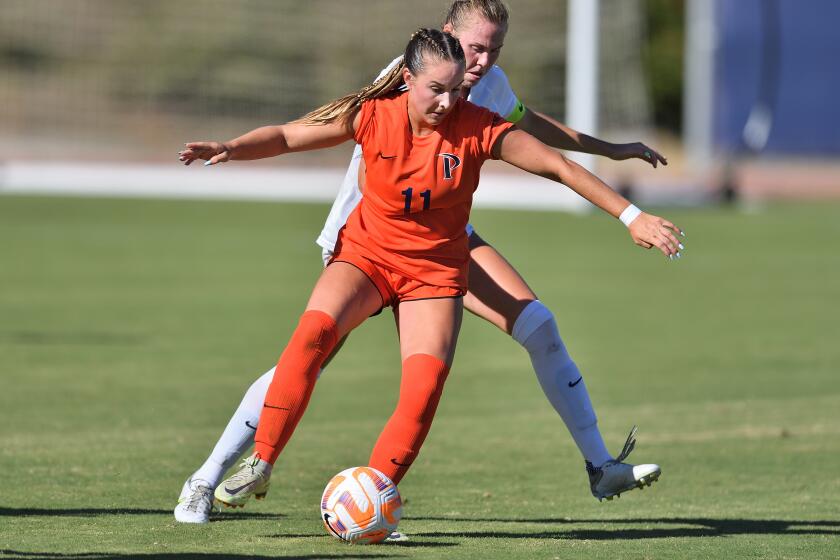 Tatum Wynalda, front, controls the ball while playing for the Pepperdine soccer team.