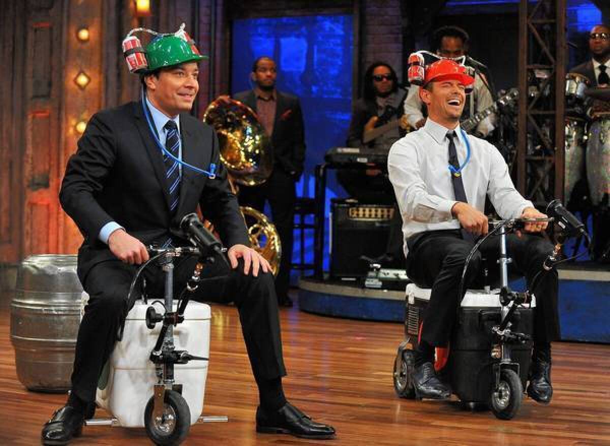 Jimmy Fallon and Josh Duhamel take part in "Cooler Races" during a taping of "Late Night With Jimmy Fallon."
