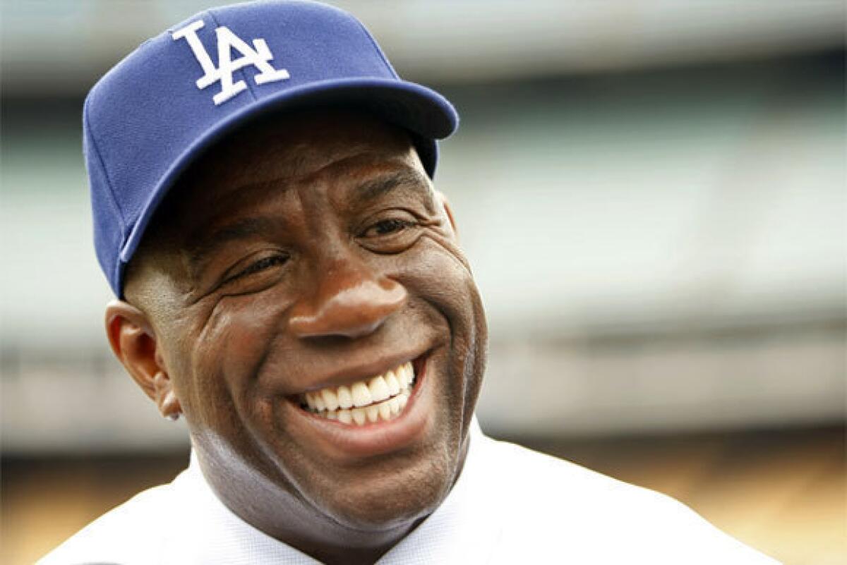 Dodgers part owner Magic Johnson can't seem to hold his tongue about the Lakers.