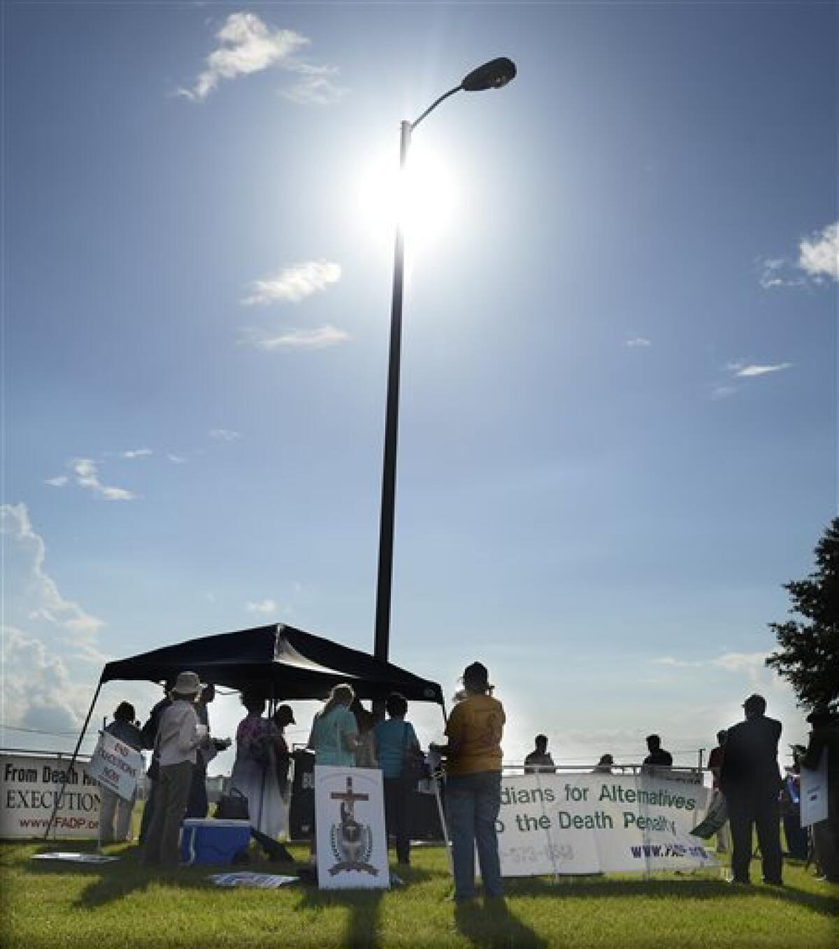 Protesters against the death penalty demonstrate in front of the Florida State Prison near Starke, Fla. Wednesday, June 18, 2014.