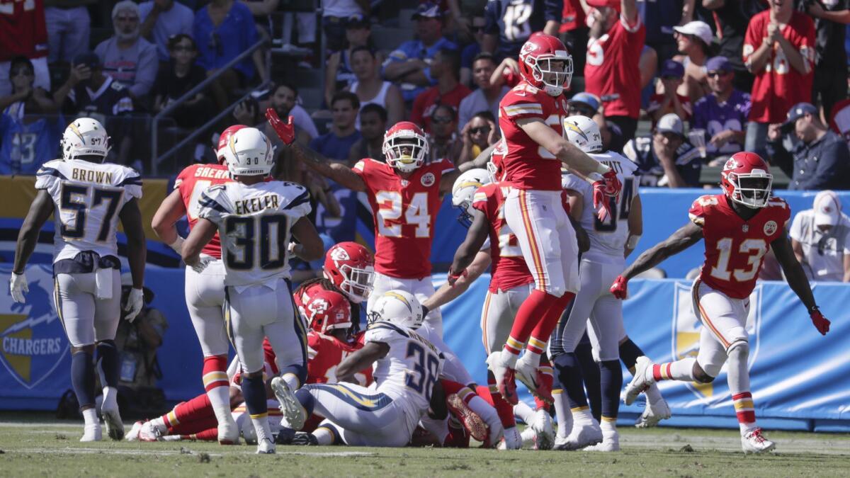 Kansas City Chief players celebrate after recovering a fumbled punt by Chargers returner JJ Jones in the second half at StubHub Center on Sunday.