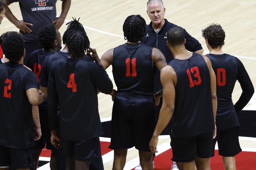 San Diego, CA, October 2, 2023: San Diego State basketball coach Brian Dutcher talks with his team during a practice at Viejas Arena on Monday, October 2, 2023. (K.C. Alfred / The San Diego Union-Tribune)