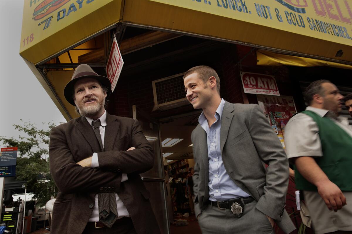 Actors Donal Logue, left, and Ben McKenzie wait to tape a scene at a deli in the Fort Green neighborhood of Brooklyn, N.Y.