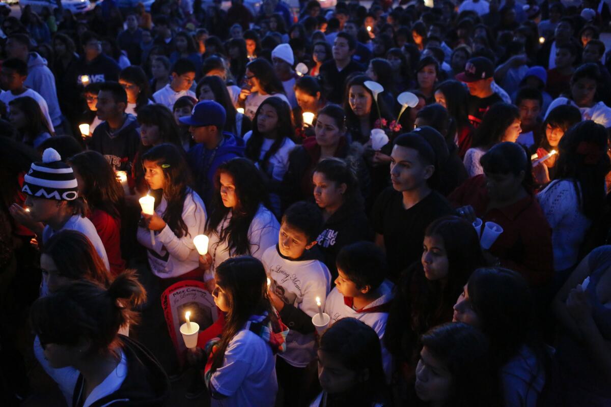 Friends and classmates of 13-year-old Angela Sandoval hold a candlelight vigil at Eastmont Intermediate School on Monday, in Montebello. Sandoval was one of five killed in a Nevada crash.