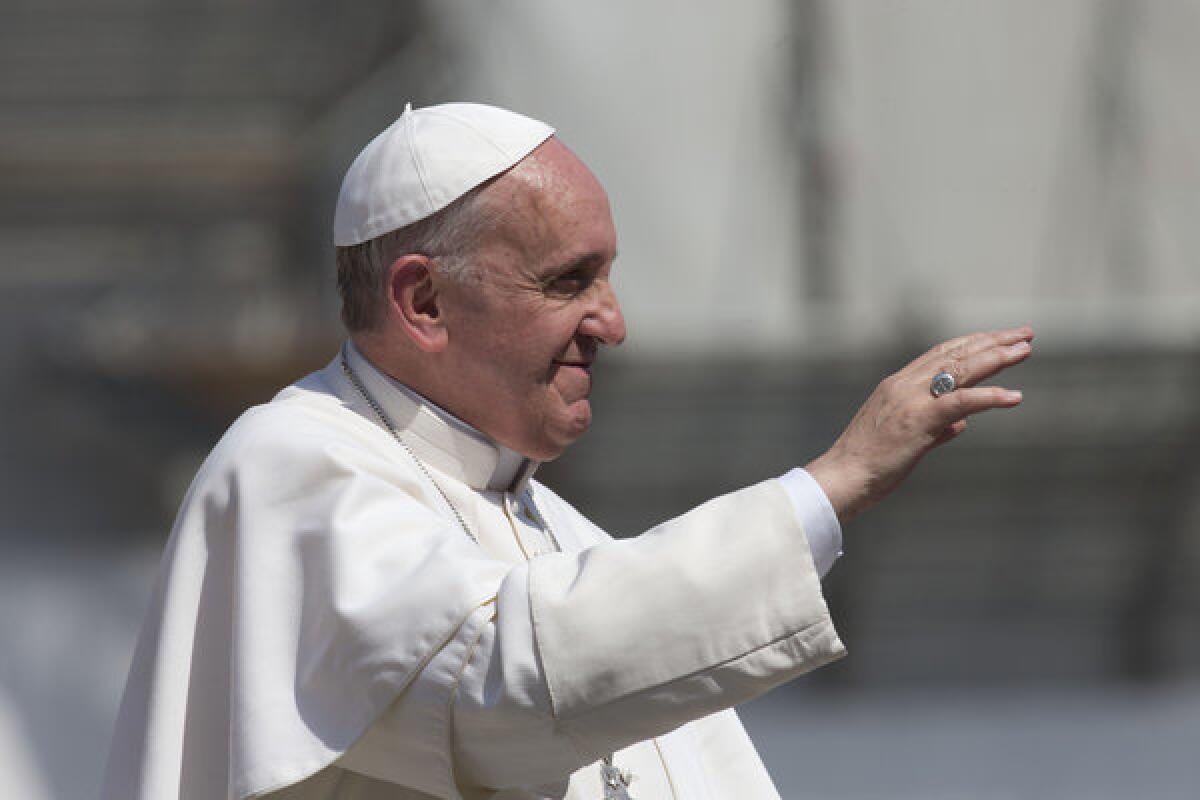 Pope Francis leaves after his weekly general audience in St. Peter's Square at the Vatican on Wednesday.