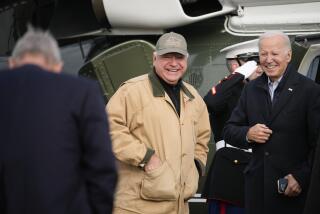 President Joe Biden and Minnesota Gov. Tim Walz wait for Agriculture Secretary Tom Vilsack as Biden prepares to depart Dutch Creek Farms in Northfield, Minn., Wednesday, Nov. 1, 2023. (AP Photo/Andrew Harnik)