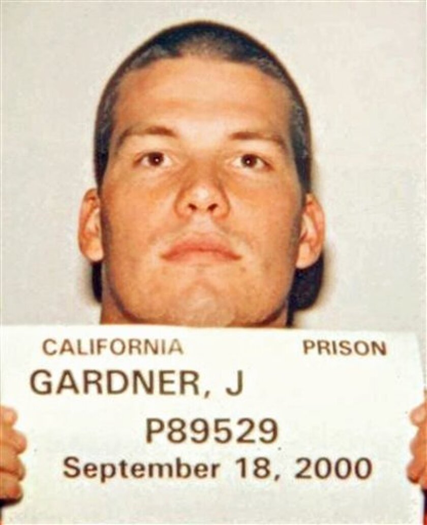 This photo released Wednesday, March 10, 2010, by the California Department of Corrections and Rehabilitation, shows murder suspect John Albert Gardner III holding a prison identification card taken Sept. 18, 2000, when he was serving time after pleading guilty to committing lewd and lascivious acts on a 13-year-old girl. Gardner has pleaded not guilty to murdering Chelsea King in San Diego County and to the attempted rape of another woman. (AP Photo/California Department of Corrections and Rehabilitation)