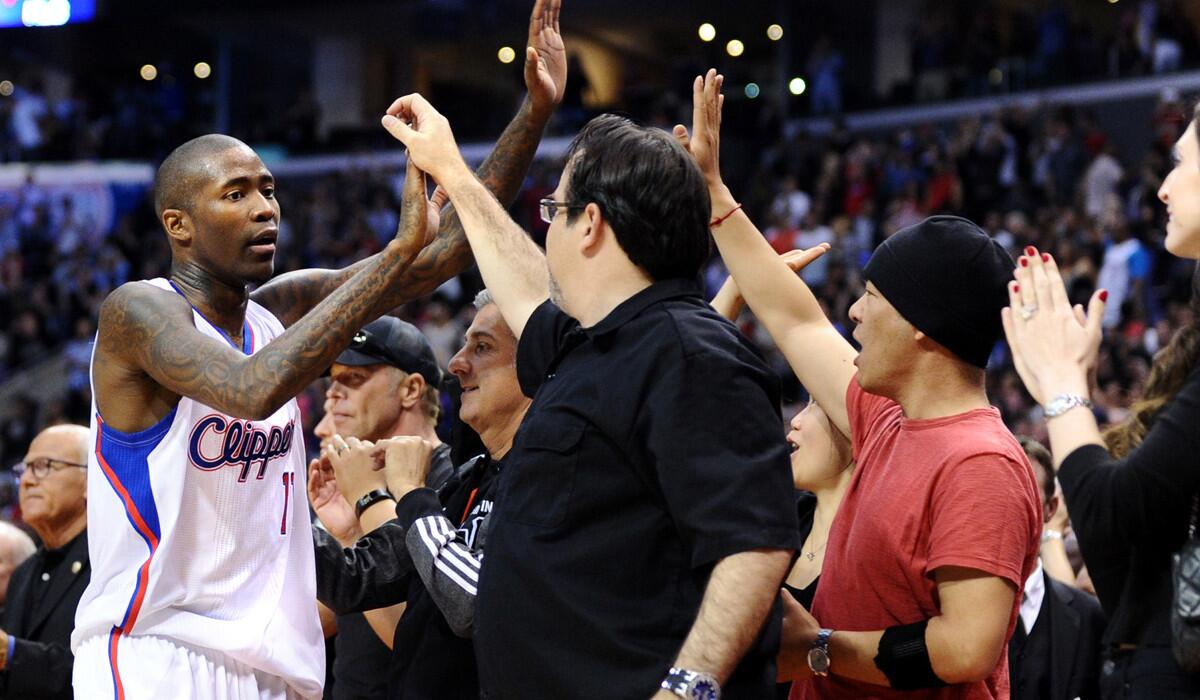 Clippers guard Jamal Crawford, high-fives fans after a victory over the Golden State Warriors in Game 5 of their series.