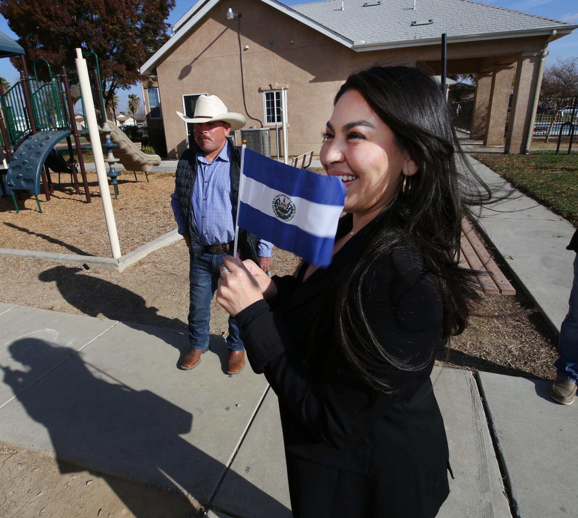 Jessenia Nunez is shown with her father, Rafael, as she gets ready at home in Mendota, Calif. before a swearing in ce