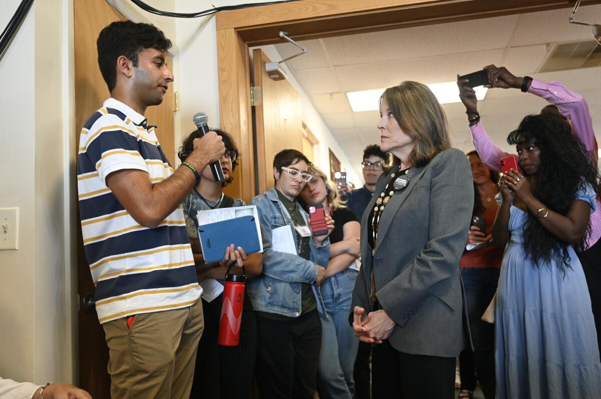 Democratic presidential candidate Marianne Williamson responds to a question from University of Michigan senior Mahi Vyas.