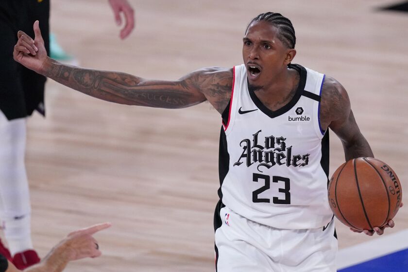 Los Angeles Clippers' Lou Williams (23) argues a call by referee Josh Tiven, left, during the second half.