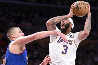 LOS ANGELES, CA - MAY 20: Los Angeles Lakers forward Anthony Davis, right, goes up for a shot.